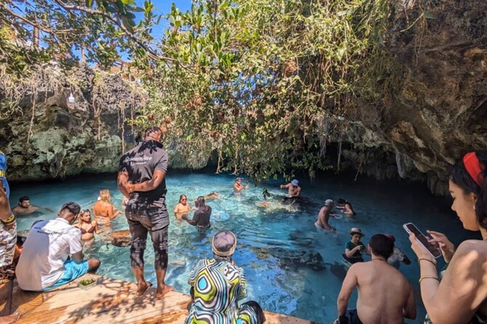 Salaam Cave Tour interior with stunning stalactites and underground pools